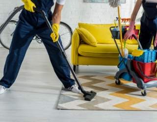 cropped view of cleaners in overalls cleaning apar XXJP3SX.jpg